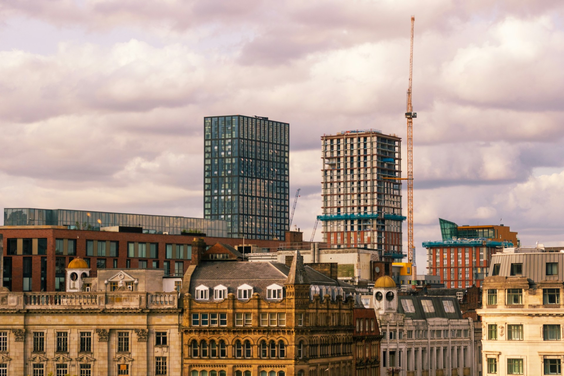 Manchester skyline is growing, a crane working on a high rise apartment building